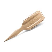 Beige hairbrush with 'Bounce Curl' branding on a white background